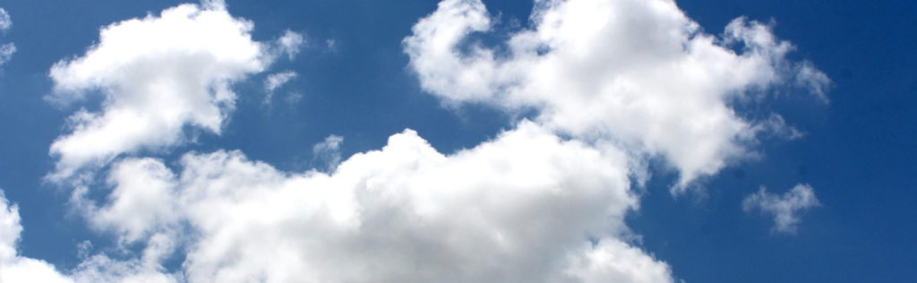 Blue sky with white puffy clouds