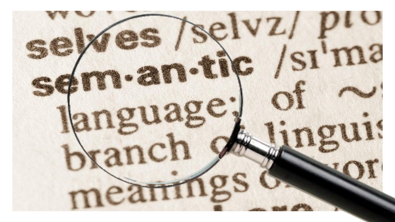 magnifying glass over a page with 'semantics' definition