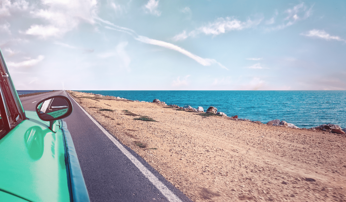 pic of the ocean out of the window of a car