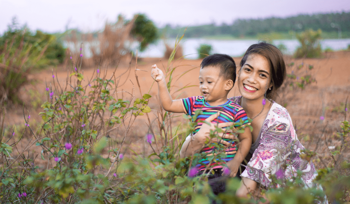 woman and toddler in a field