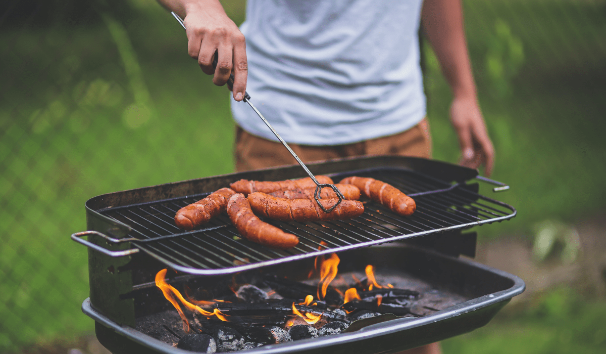 close up view of a grill with sausages