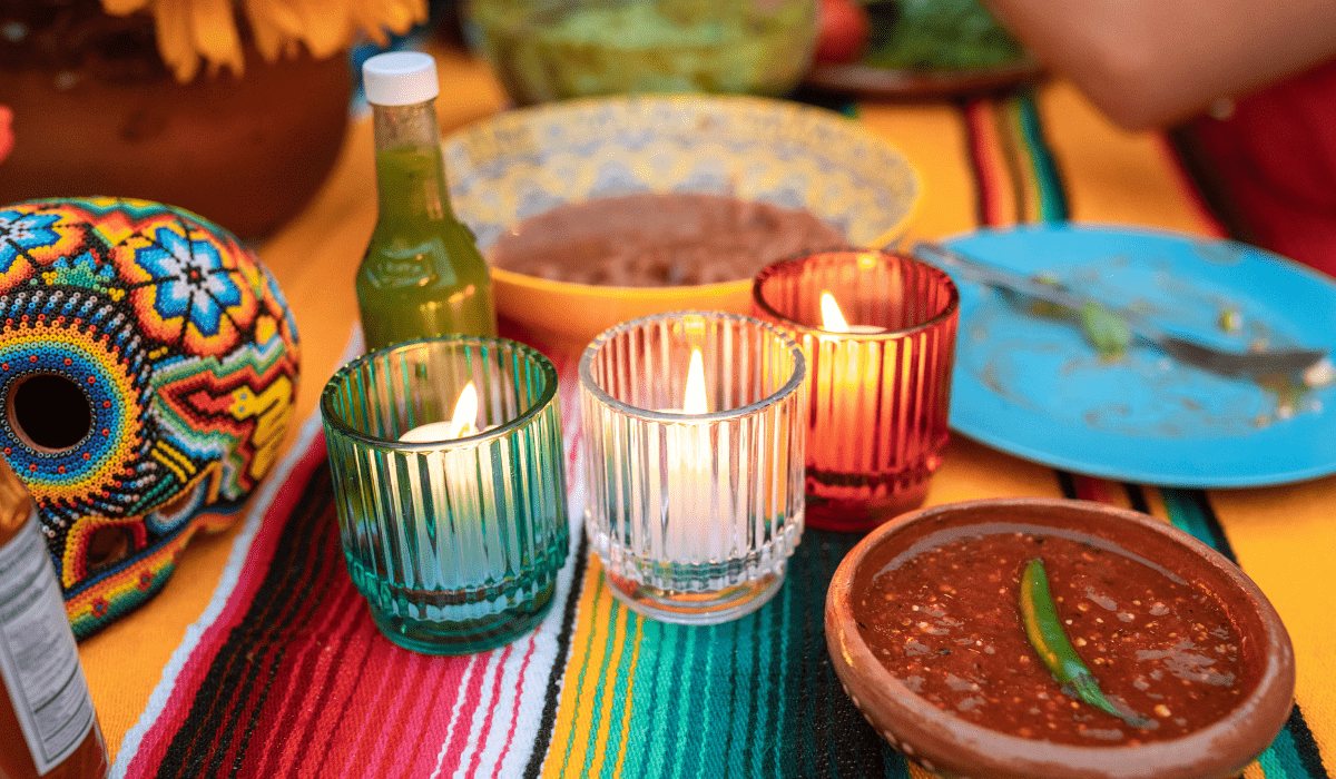 view of candles, salsa, and festive table decorations
