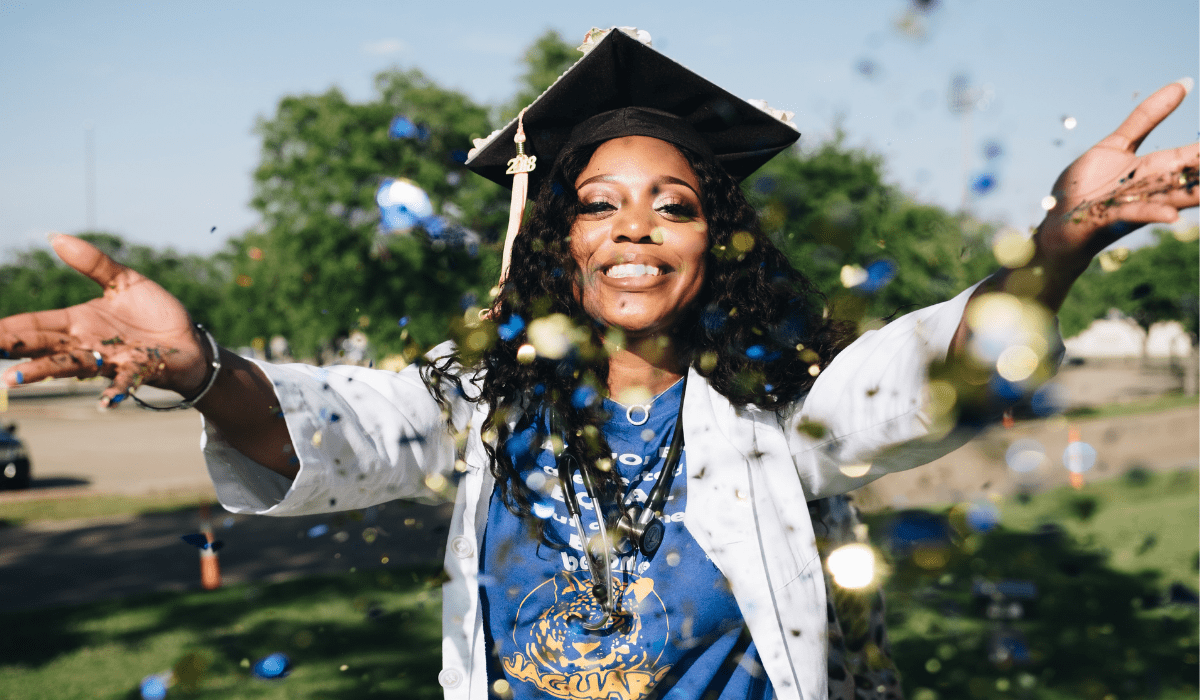graduate throwing confetti