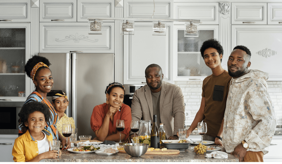 family gathered in the kitchen around a meal