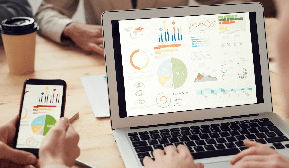 A laptop with an image of graphs and data