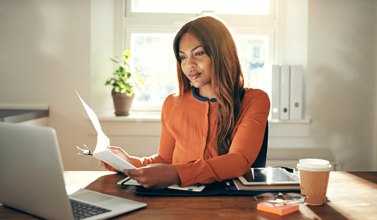 Woman at a desk working on a computer